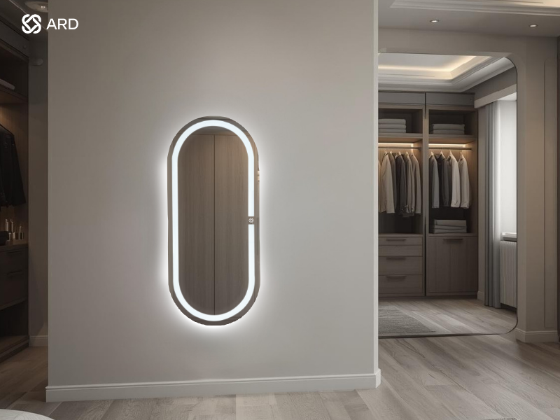 Espejo ARD de cuerpo completo con encendido touch modelo oval elegance en vestidor minimalista